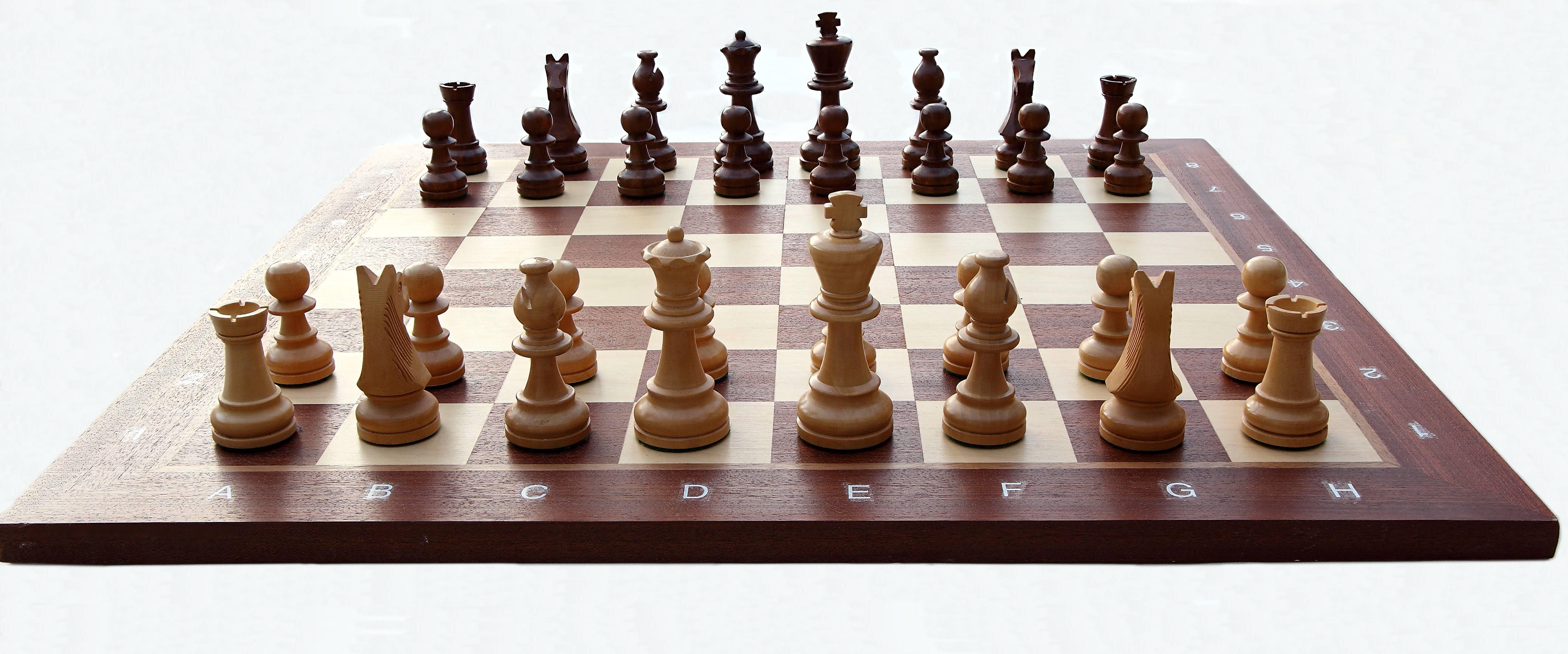 Chess_board_with_chess_set_in_opening_position_2012_PD_05.jpg